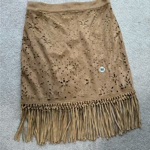 Suede knee length with floral cutouts and knee length fringe.